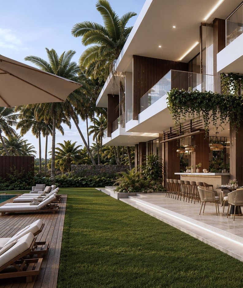 Shaded outdoor terrace with loungers beside a lawn